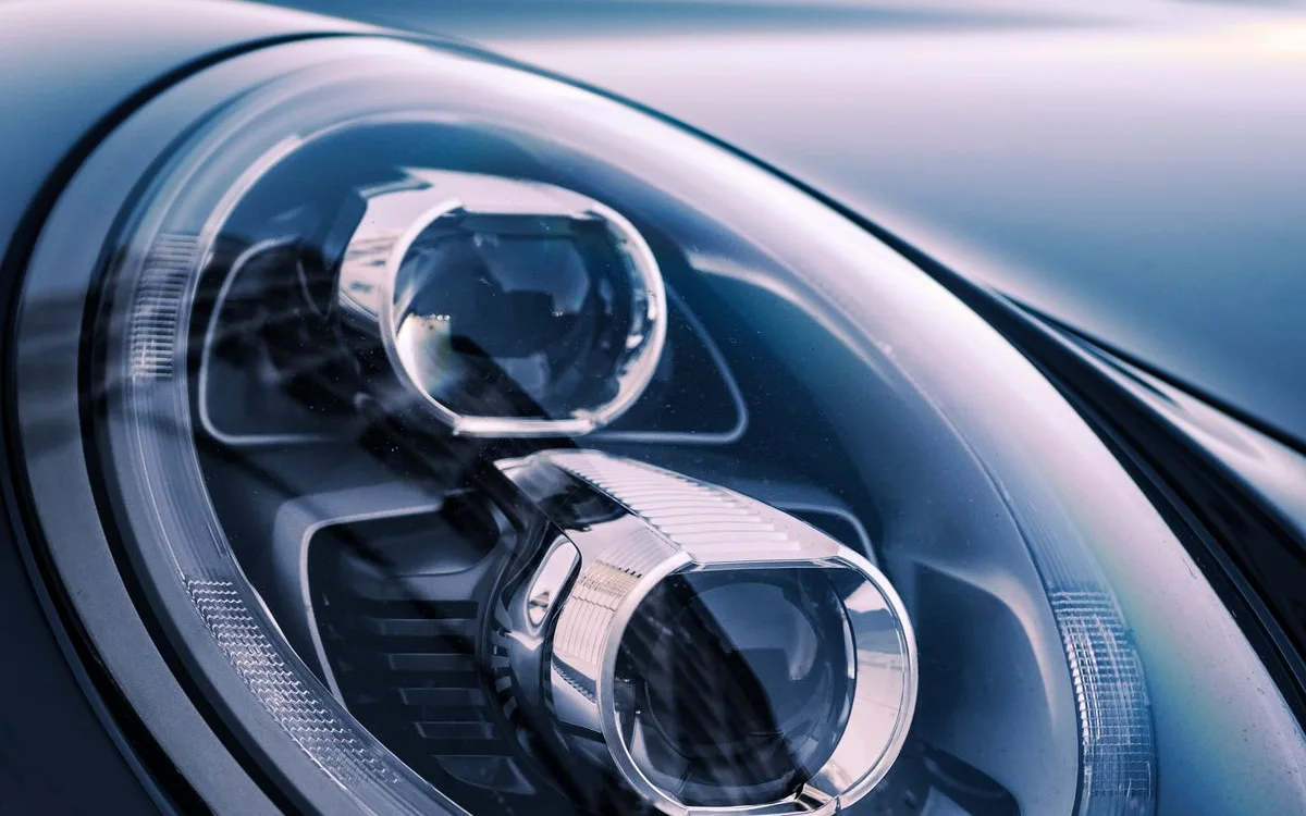 Porsche headlamp — replaced, aimed and coded at Alfa Garage Miami