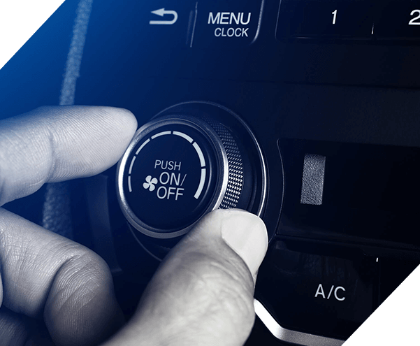 Hand of man tuning and open air condition button on car for ac repair